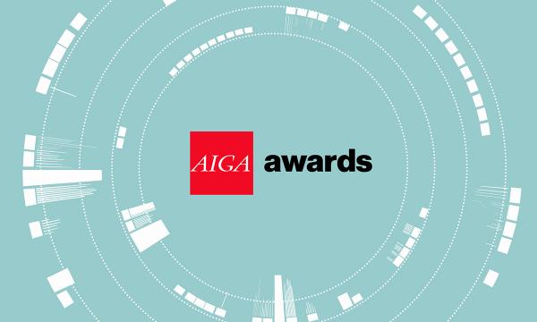 AIGA Awards logo lockup AIGA Awards logo lockup, AIGA letters in white inside a red square box followed by the word awards in lowercase black type against a light turquoise background with concentric white circles that resemble a camera lens.
