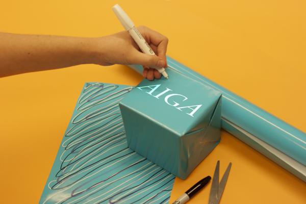 Gift AIGA Image of a wrapped gift with AIGA logo